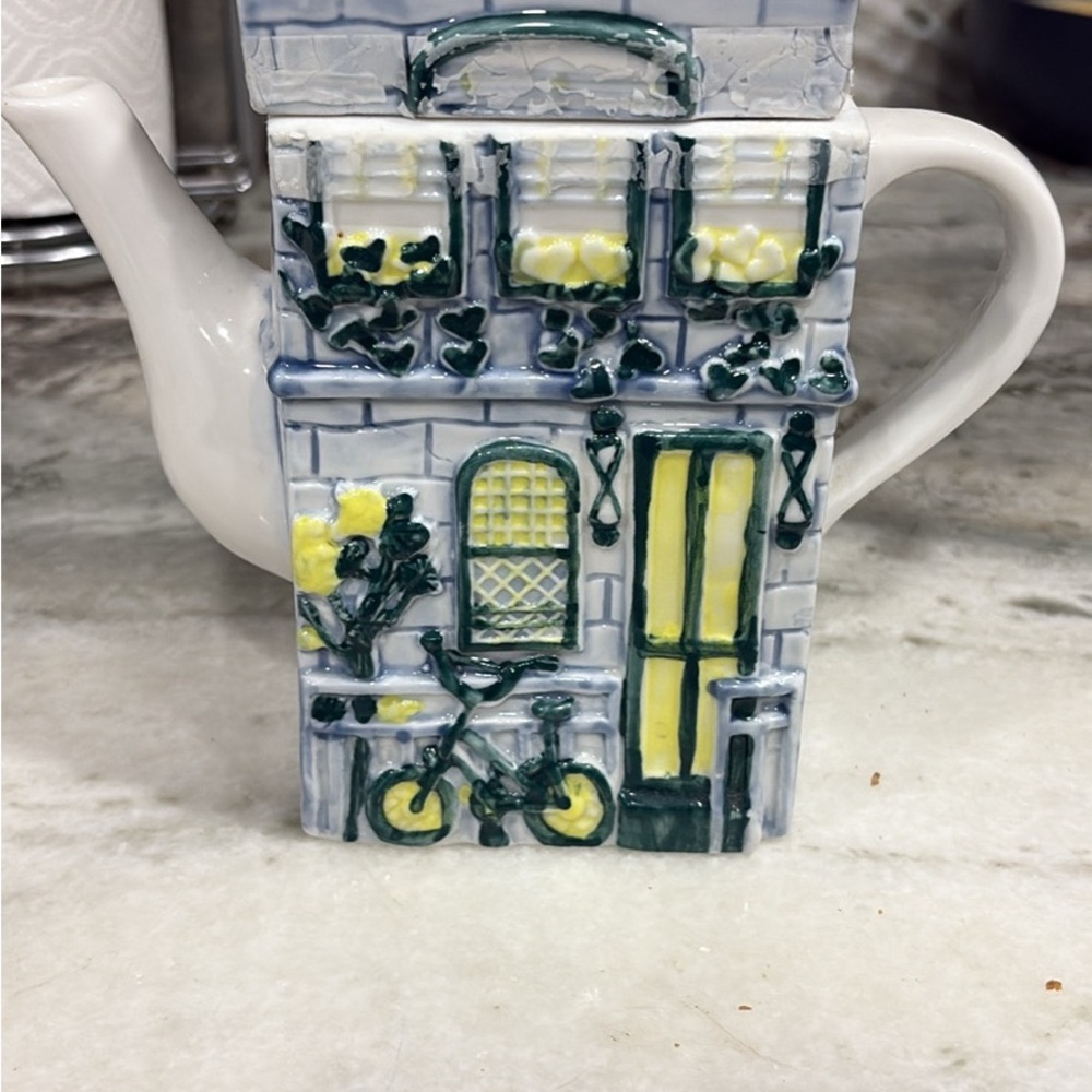 Charming House Teapot with Bicycle Design